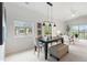 Stylish dining area with contemporary lighting, neutral decor, and a bright, open space at 11364 Xavier Dr # 205, Westminster, CO 80031