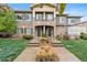 Inviting townhouse with a stone facade, lush landscaping, and a well-maintained front yard at 11364 Xavier Dr # 205, Westminster, CO 80031