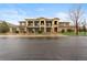 Attractive townhome complex featuring a stone and siding facade, private balconies, and attached garages at 11364 Xavier Dr # 205, Westminster, CO 80031