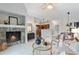 Stylish living room with a marble fireplace, modern furniture, and an open floor plan at 11364 Xavier Dr # 205, Westminster, CO 80031