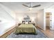 Spacious bedroom offering ample natural light, ceiling fan and comfortable furnishings at 186 S Nome St, Aurora, CO 80012