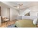 Bright bedroom with a ceiling fan, wood floors, an area rug and light-filled awning windows at 186 S Nome St, Aurora, CO 80012