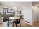 Bright dining area featuring a round table, modern lighting and large windows at 186 S Nome St, Aurora, CO 80012