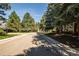 A street view of the neighborhood with mature trees at 186 S Nome St, Aurora, CO 80012