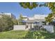 A backyard featuring a lawn, patio area, and tasteful landscaping with a view of the home at 9200 E Cherry Creek South Dr # 10, Denver, CO 80231