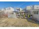 Backyard view featuring two patio sets and a grill, perfect for outdoor entertaining and summer barbecues at 9200 E Cherry Creek South Dr # 10, Denver, CO 80231