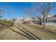 Backyard view showcases a row of townhomes, shaded patios, and well-maintained lawns, perfect for relaxation at 9200 E Cherry Creek South Dr # 10, Denver, CO 80231