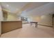 Large finished basement with a classic bar, natural light, and a pool table, plenty of space at 9200 E Cherry Creek South Dr # 10, Denver, CO 80231