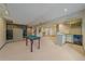 Finished basement with a pool table, wet bar, and ample space for entertainment at 9200 E Cherry Creek South Dr # 10, Denver, CO 80231