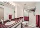Clean bathroom with shower and burgundy tile at 9200 E Cherry Creek South Dr # 10, Denver, CO 80231