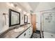 Modern bathroom featuring double sinks, a shower, and stylish fixtures at 9200 E Cherry Creek South Dr # 10, Denver, CO 80231