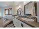 Modern bathroom with double sinks, sleek fixtures, and a separate tub at 9200 E Cherry Creek South Dr # 10, Denver, CO 80231
