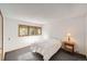 Serene bedroom featuring a queen-size bed and wooded views at 9200 E Cherry Creek South Dr # 10, Denver, CO 80231