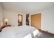 Well-lit bedroom with a double bed and built in closet at 9200 E Cherry Creek South Dr # 10, Denver, CO 80231