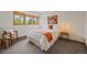 Inviting bedroom featuring a large window and warm neutral decor, and a chair with natural light at 9200 E Cherry Creek South Dr # 10, Denver, CO 80231