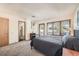 Bright bedroom with a comfortable bed and access to a private balcony at 9200 E Cherry Creek South Dr # 10, Denver, CO 80231