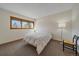 Minimalist bedroom with natural light, a cozy bed, and modern furnishings at 9200 E Cherry Creek South Dr # 10, Denver, CO 80231