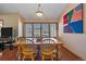 Charming dining room with wood floors and large windows with a window-seat provides lots of natural light at 9200 E Cherry Creek South Dr # 10, Denver, CO 80231