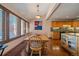Dining room with natural light, hardwood floors, adjacent to kitchen with wood cabinets at 9200 E Cherry Creek South Dr # 10, Denver, CO 80231