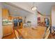 Open floor plan with dining room flowing into kitchen and living area, perfect for entertaining at 9200 E Cherry Creek South Dr # 10, Denver, CO 80231