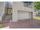 Townhouse exterior featuring a private entrance, attached garage, and balcony at 9200 E Cherry Creek South Dr # 10, Denver, CO 80231
