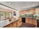 Kitchen boasts light wood cabinets, granite countertops, and a large island at 9200 E Cherry Creek South Dr # 10, Denver, CO 80231