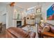 Bright living room featuring a fireplace, hardwood floors, and a two-story ceiling at 9200 E Cherry Creek South Dr # 10, Denver, CO 80231