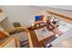 Aerial view of a cozy living room with hardwood floors, a fireplace, and a comfortable seating area at 9200 E Cherry Creek South Dr # 10, Denver, CO 80231
