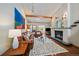 Cozy living room boasts a fireplace, hardwood floors, and bright, airy atmosphere at 9200 E Cherry Creek South Dr # 10, Denver, CO 80231