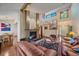 Bright living room features a fireplace, hardwood floors, and stairway to the second floor at 9200 E Cherry Creek South Dr # 10, Denver, CO 80231