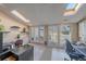 Bright home office with built-in storage and natural light from large windows and skylights at 9200 E Cherry Creek South Dr # 10, Denver, CO 80231