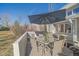 Covered patio area featuring a glass table, six chairs, and a view of the yard and neighborhood at 9200 E Cherry Creek South Dr # 10, Denver, CO 80231