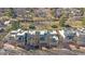 Aerial view of modern townhomes with neutral exteriors, landscaping, and nearby trees at 9200 E Cherry Creek South Dr # 10, Denver, CO 80231