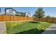 Fenced backyard with grass and gravel at 27891 E 7Th Ave, Aurora, CO 80018