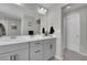 Bathroom with double vanity and a door to another room at 27891 E 7Th Ave, Aurora, CO 80018