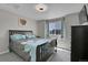 Bedroom with dark wood bed frame and window at 27891 E 7Th Ave, Aurora, CO 80018