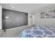 Bedroom with gray accent wall and carpet flooring at 27891 E 7Th Ave, Aurora, CO 80018