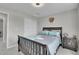 Bedroom with dark wood bed frame and sliding door at 27891 E 7Th Ave, Aurora, CO 80018