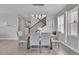 Dining room with hardwood floors, modern light fixture, and seating for six at 27891 E 7Th Ave, Aurora, CO 80018