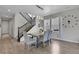 Bright dining room features a table with seating for six and hardwood floors at 27891 E 7Th Ave, Aurora, CO 80018