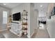 Bright entryway with built-in shelving, hardwood floors, and view into living room at 27891 E 7Th Ave, Aurora, CO 80018