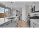 Modern kitchen with stainless steel appliances and farmhouse sink at 27891 E 7Th Ave, Aurora, CO 80018