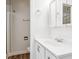 Bathroom featuring a shower with glass door and a vanity with storage, plus modern fixtures at 16104 E Alaska Pl # D, Aurora, CO 80017