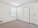 Bright bedroom with neutral carpet and trim, and several large closets for ample storage at 16104 E Alaska Pl # D, Aurora, CO 80017