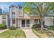 Charming townhome featuring a well-maintained lawn, mature tree, and inviting front entrance at 16104 E Alaska Pl # D, Aurora, CO 80017