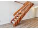 Wooden staircase with carpet treads in a bright and airy living space at 16104 E Alaska Pl # D, Aurora, CO 80017