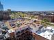 Scenic rooftop view with city buildings, a park, roads and the Rocky Mountains at 1435 Wazee St # 504, Denver, CO 80202