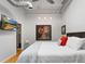 Cozy bedroom featuring hardwood floors, modern lighting, and a flat-screen TV at 1435 Wazee St # 504, Denver, CO 80202