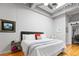 Bright bedroom with hardwood floors, exposed ductwork, ample closet space, and a dedicated office area at 1435 Wazee St # 504, Denver, CO 80202