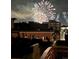View of a vibrant fireworks display over the city buildings at night with multiple buildings shown at 1435 Wazee St # 504, Denver, CO 80202